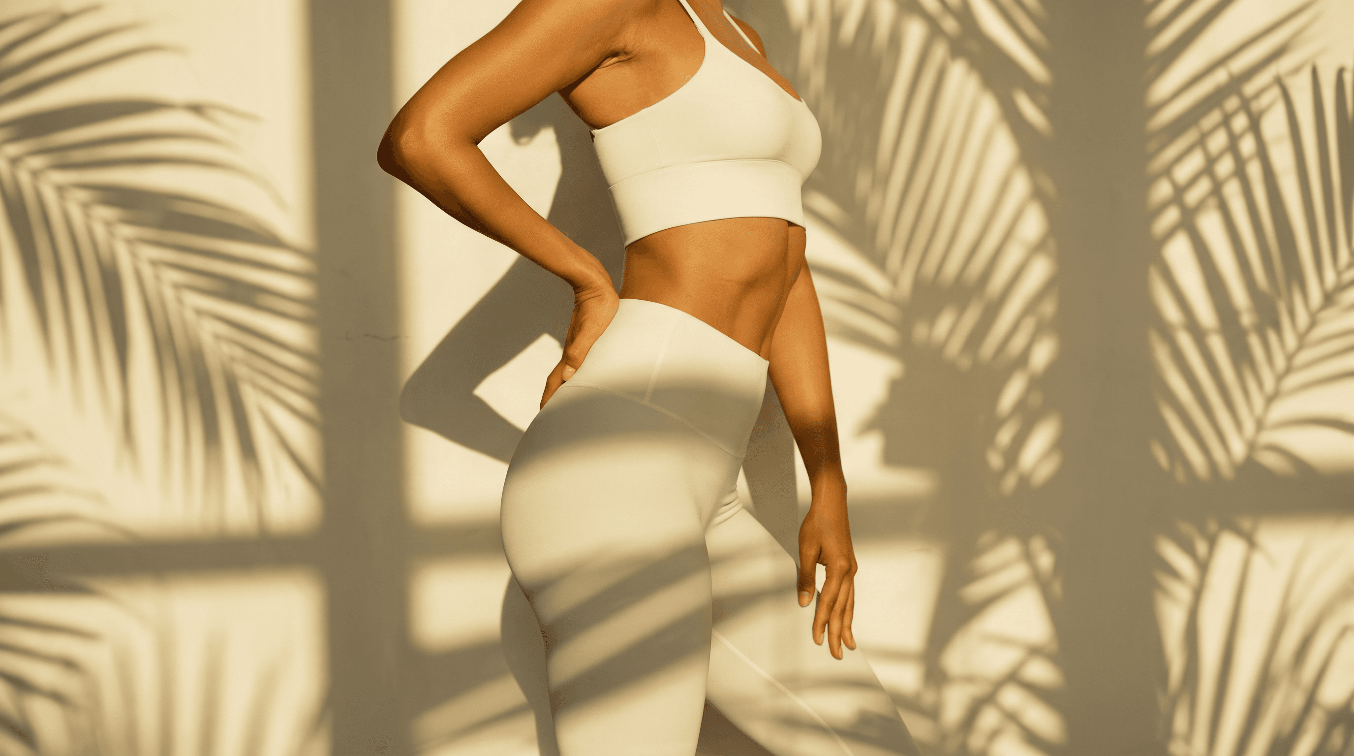 Non-surgical body contouring in Miami — sculpted silhouette in warm golden light