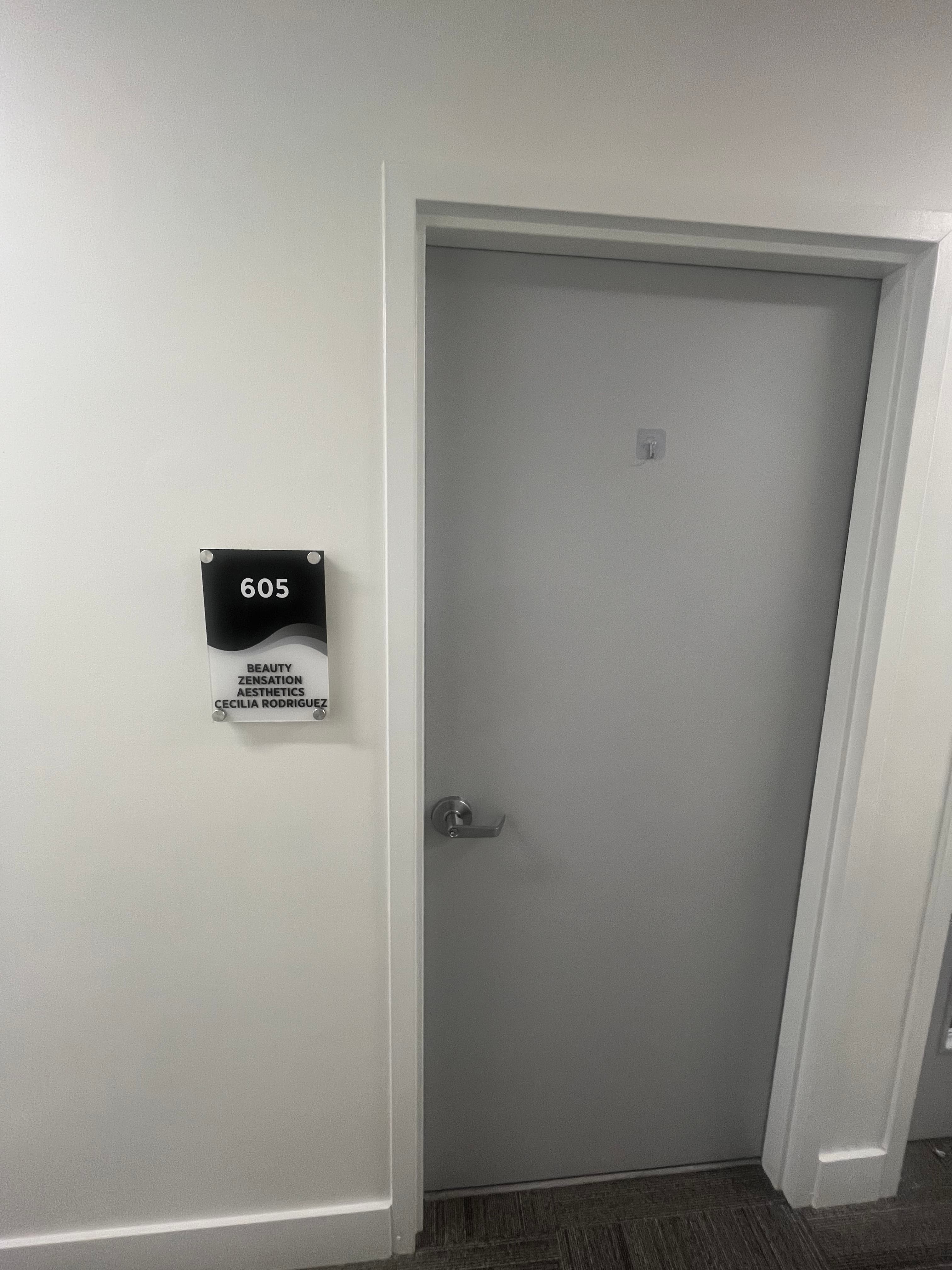 Suite 605 door signed Beauty Zensation Aesthetics — Cecilia Rodriguez
