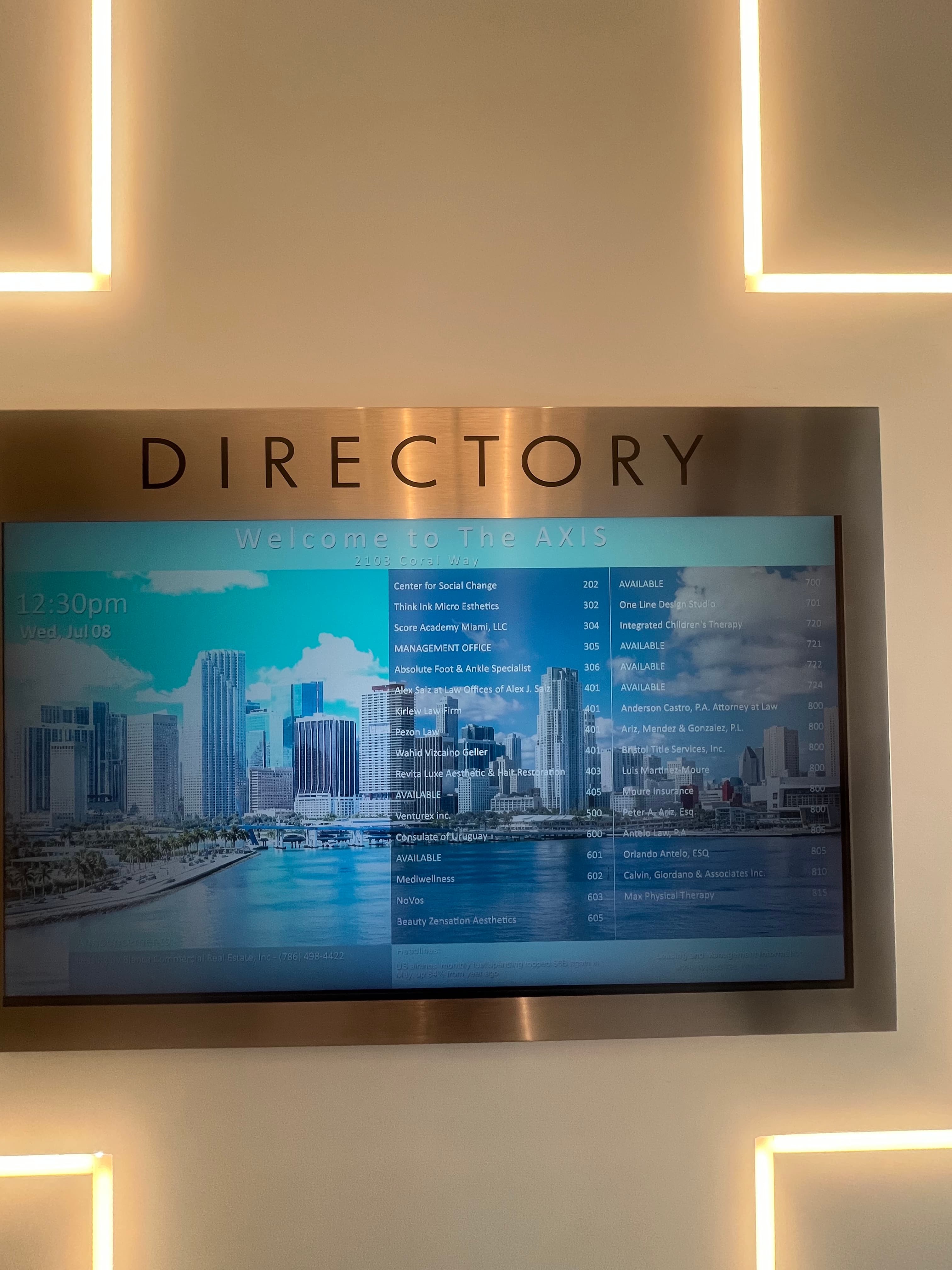 The AXIS building directory screen listing Beauty Zensation Aesthetics, Suite 605